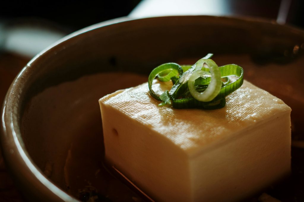 Delicious fresh tofu garnished with sliced green onions, served in Kyoto style.